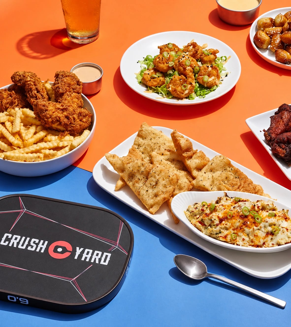 Crush Yard shareables, crispy chicken and dips spread across the table