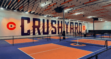 Orange and purple indoor courts at Crush Yard Charleston