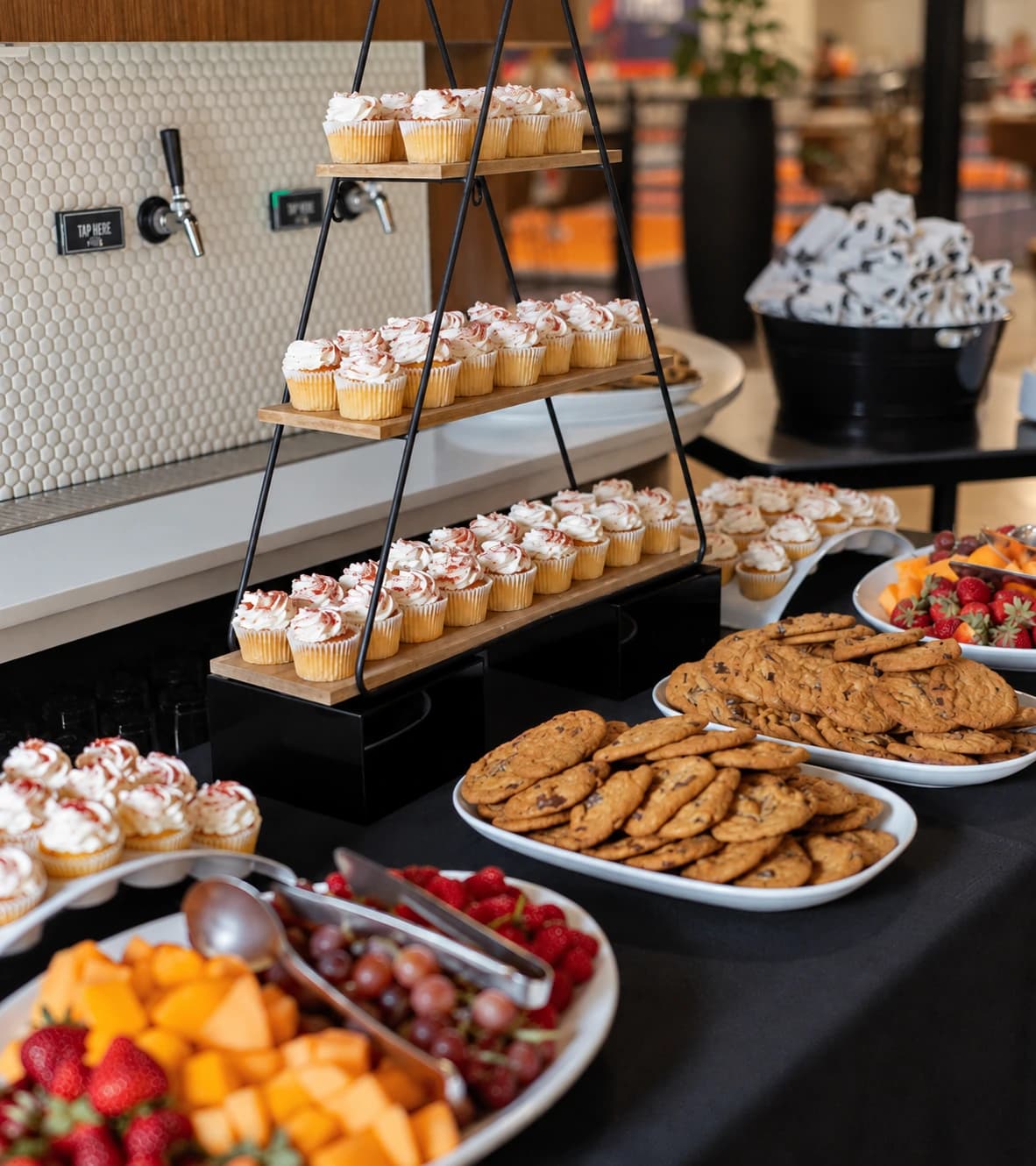 Cupcakes, cookies and fruit set out for a celebration at Crush Yard
